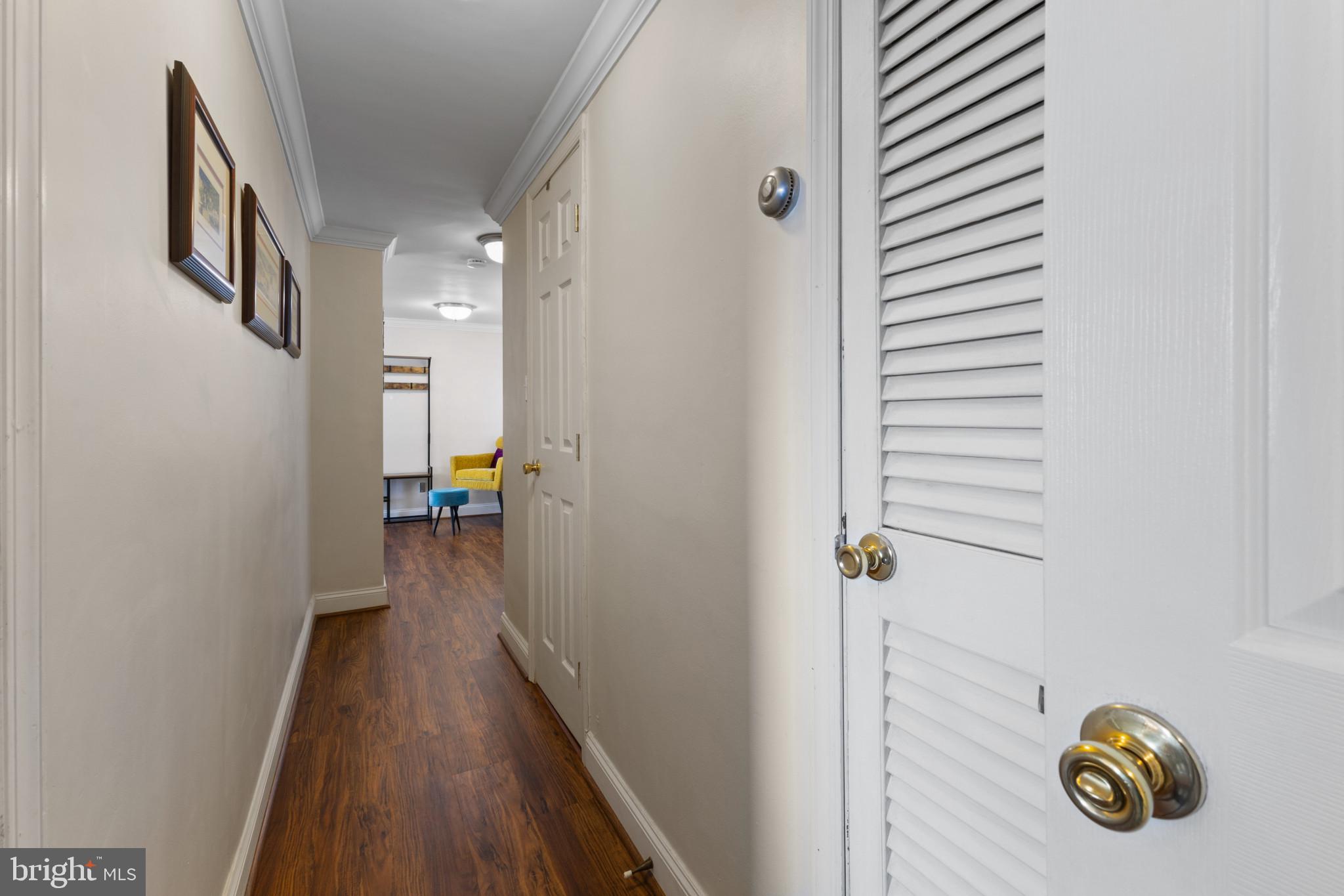 4600 Duke Street, Unit 613 Alexandria, VA 22304 - Photo 19 of 32 a view of a hallway with wooden floor and closet