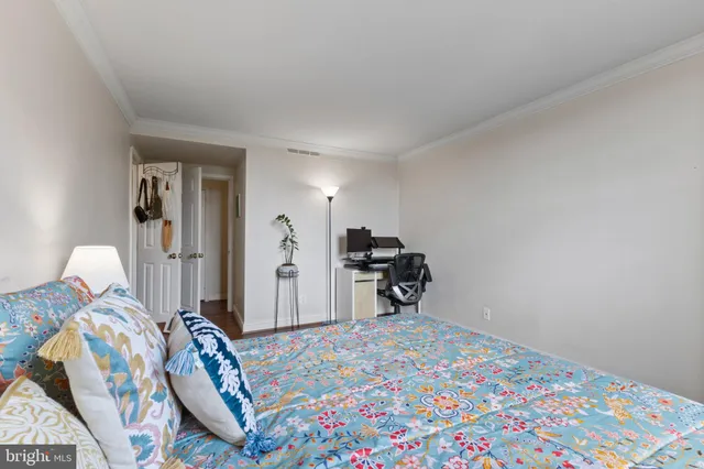 a bedroom with bed and a cabinets