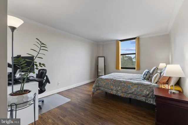 a bedroom with bed and window