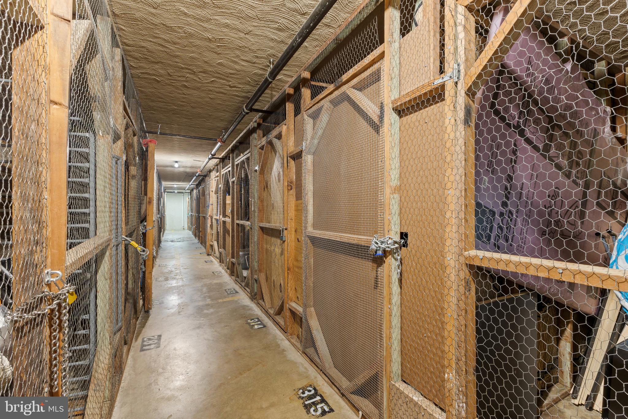4600 Duke Street, Unit 613 Alexandria, VA 22304 - Photo 27 of 32 a view of walk in closet with wooden floor and stairs
