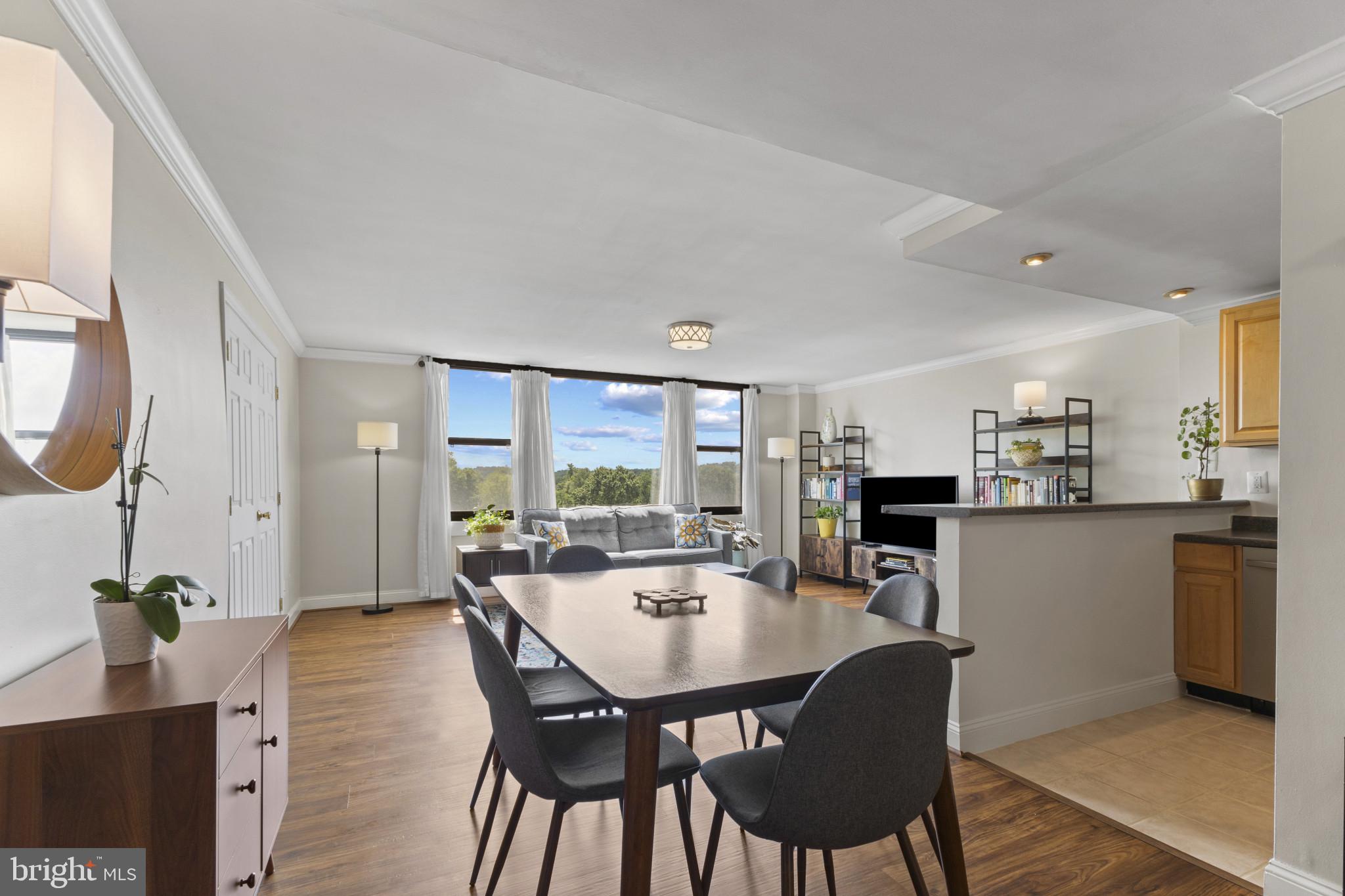 4600 Duke Street, Unit 613 Alexandria, VA 22304 - Photo 7 of 32 a view of a dining room with furniture window and outside view