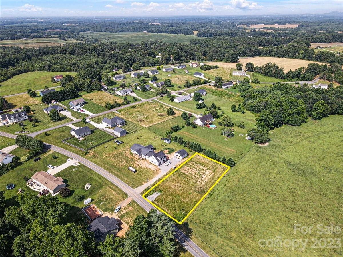 151 Rabbit Highway Harmony, NC 28634 - Photo 2 of 9 an aerial view of residential houses with outdoor space