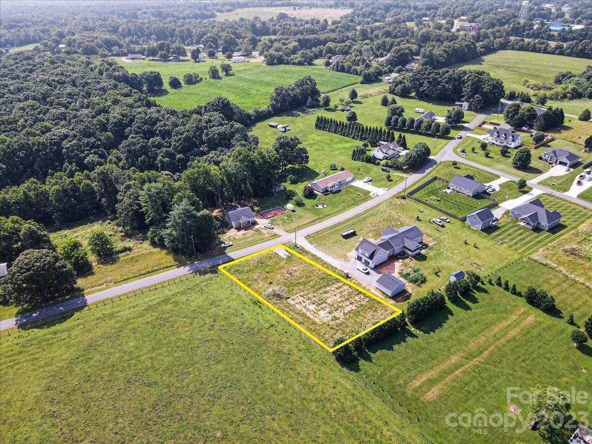 151 Rabbit Highway Harmony, NC 28634 - Photo 4 of 9 an aerial view of a tennis ground and a cars park side of the road