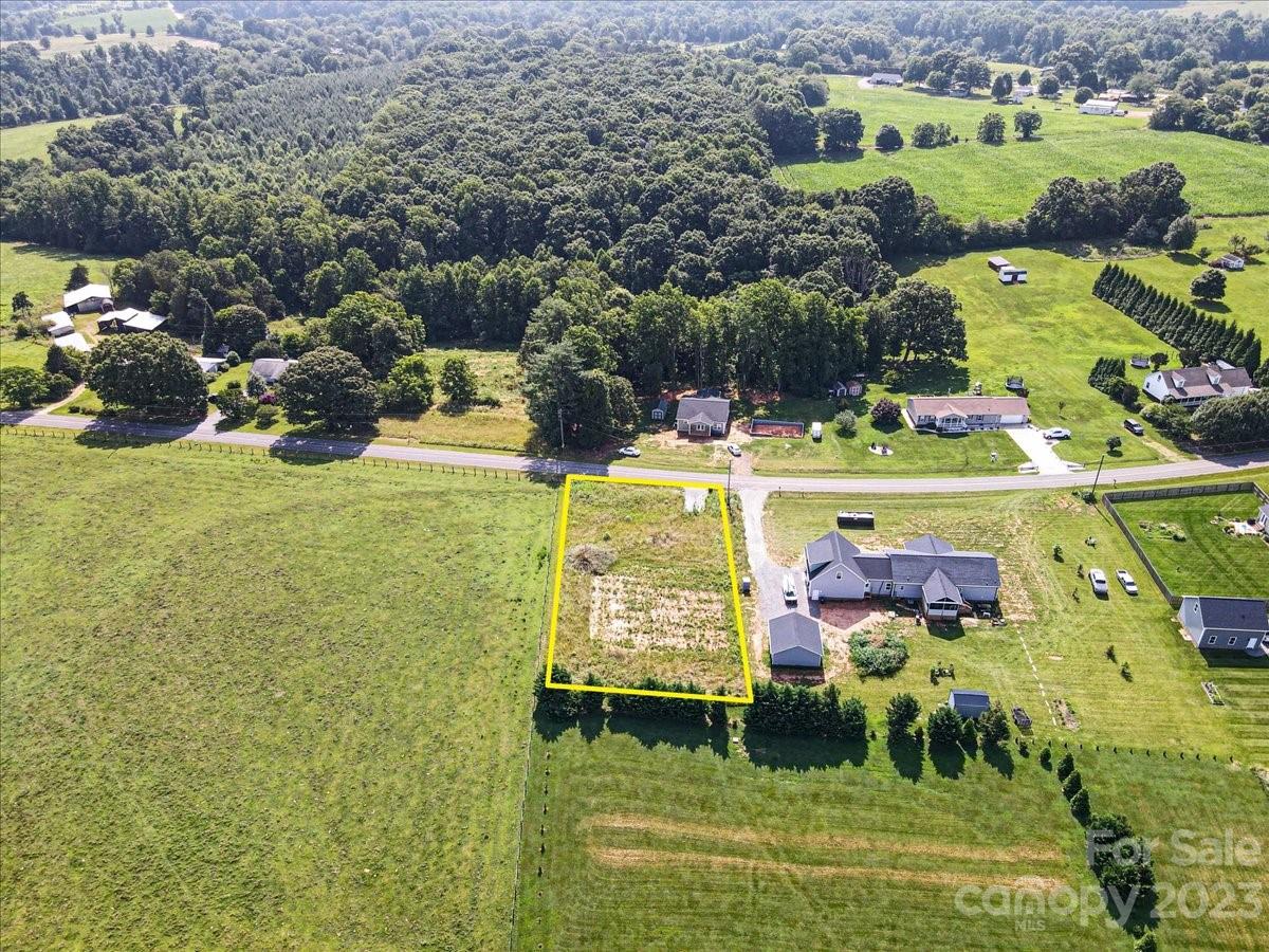 151 Rabbit Highway Harmony, NC 28634 - Photo 5 of 9 a view of a swimming pool and a yard