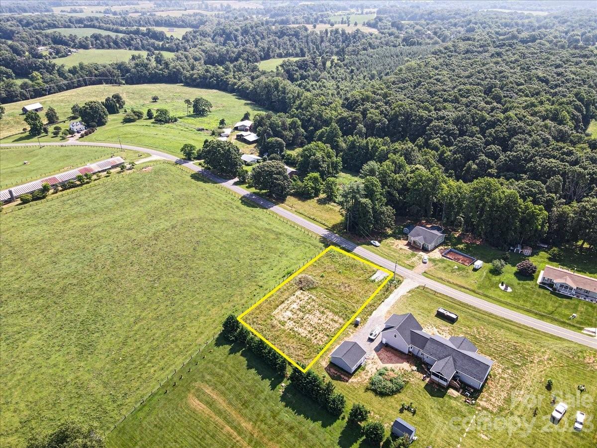 151 Rabbit Highway Harmony, NC 28634 - Photo 6 of 9 an aerial view of a house with a swimming pool