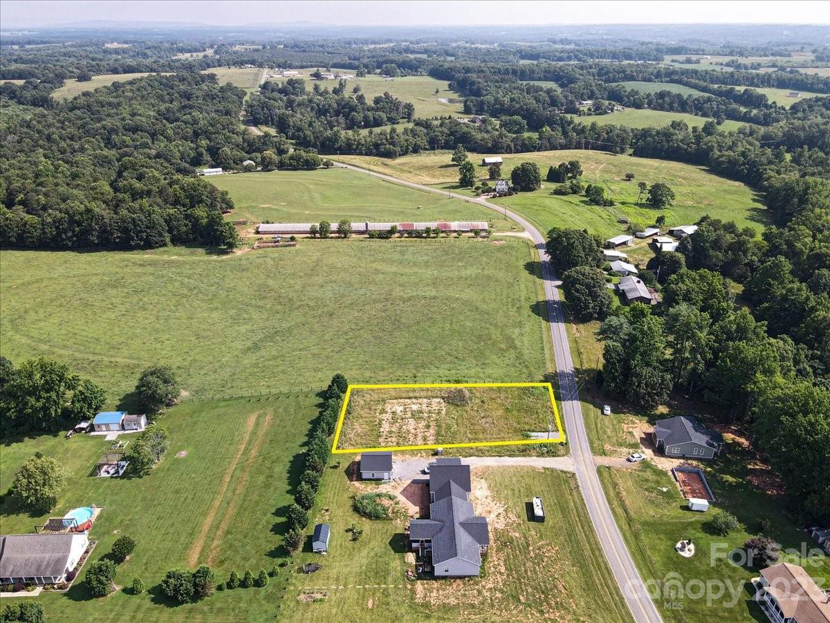 151 Rabbit Highway Harmony, NC 28634 - Photo 8 of 9 an aerial view of a house with a lake view