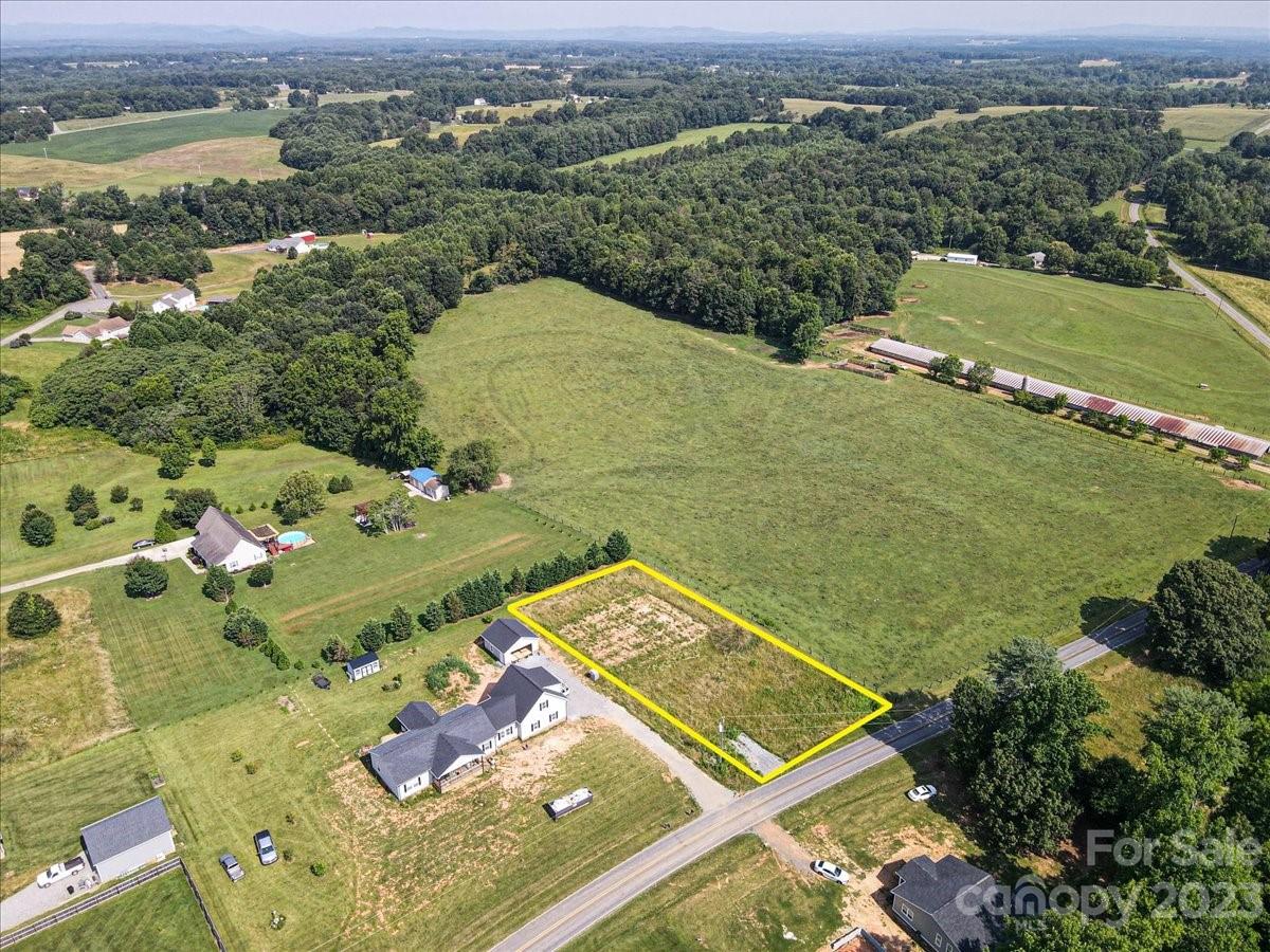 151 Rabbit Highway Harmony, NC 28634 - Photo 9 of 9 an aerial view of residential houses with outdoor space