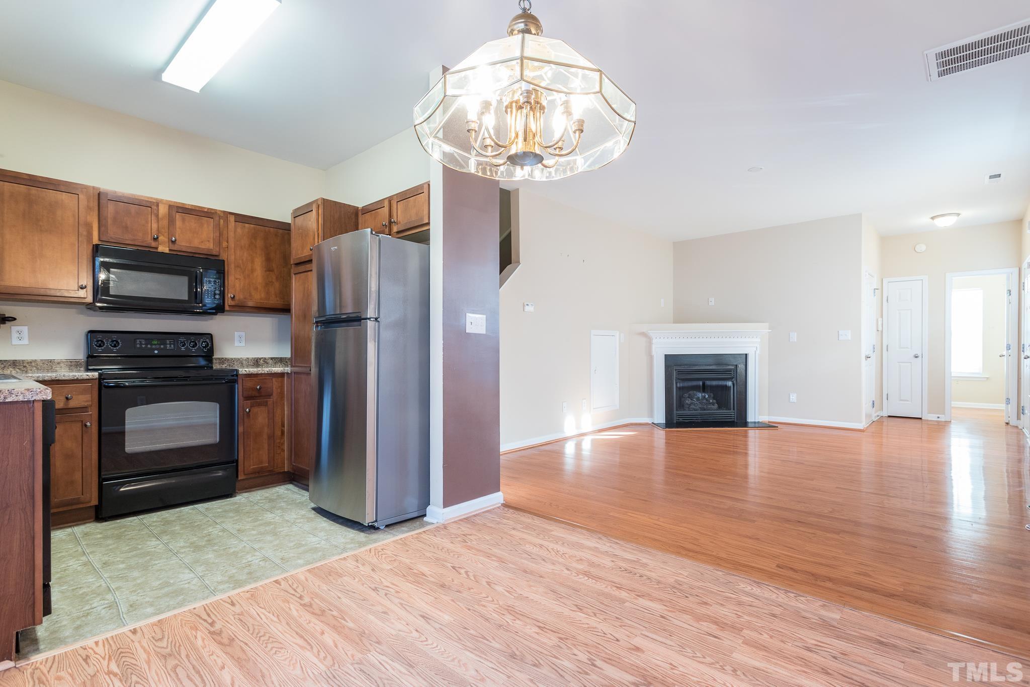 2153 Metacomet Way Raleigh, NC 27604 - Photo 14 of 30 a view of kitchen with sink microwave and refrigerator