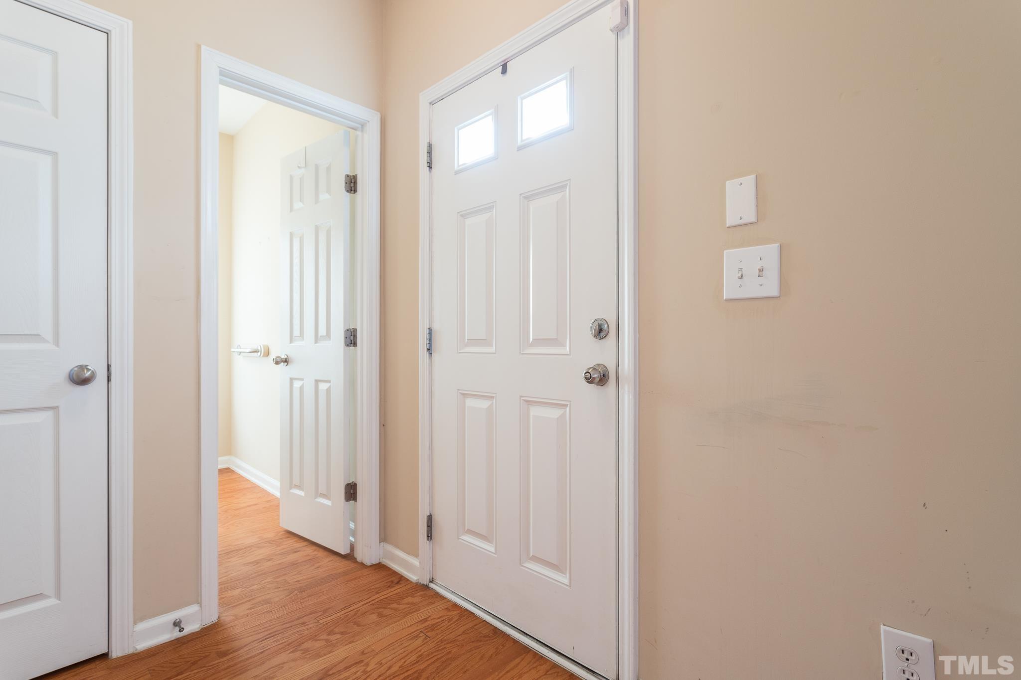 2153 Metacomet Way Raleigh, NC 27604 - Photo 4 of 30 a view of a hallway with wooden floor