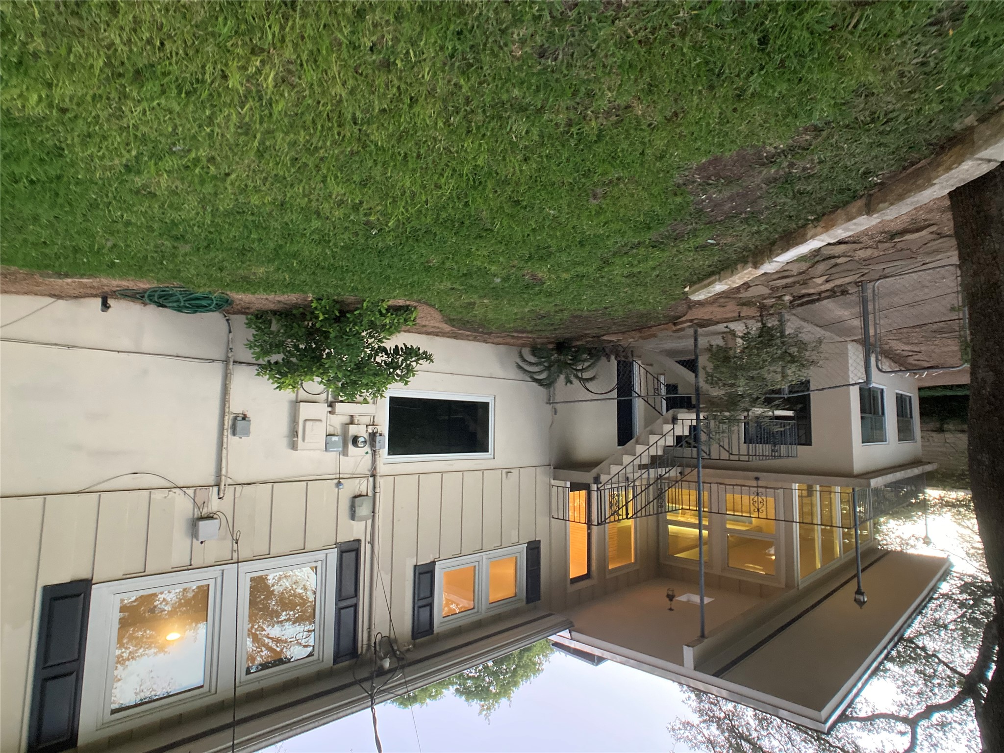 3509 River Road Austin, TX 78703 - Photo 40 of 40 See outside stairs. Black doors behind stairs to both downstair spaces.