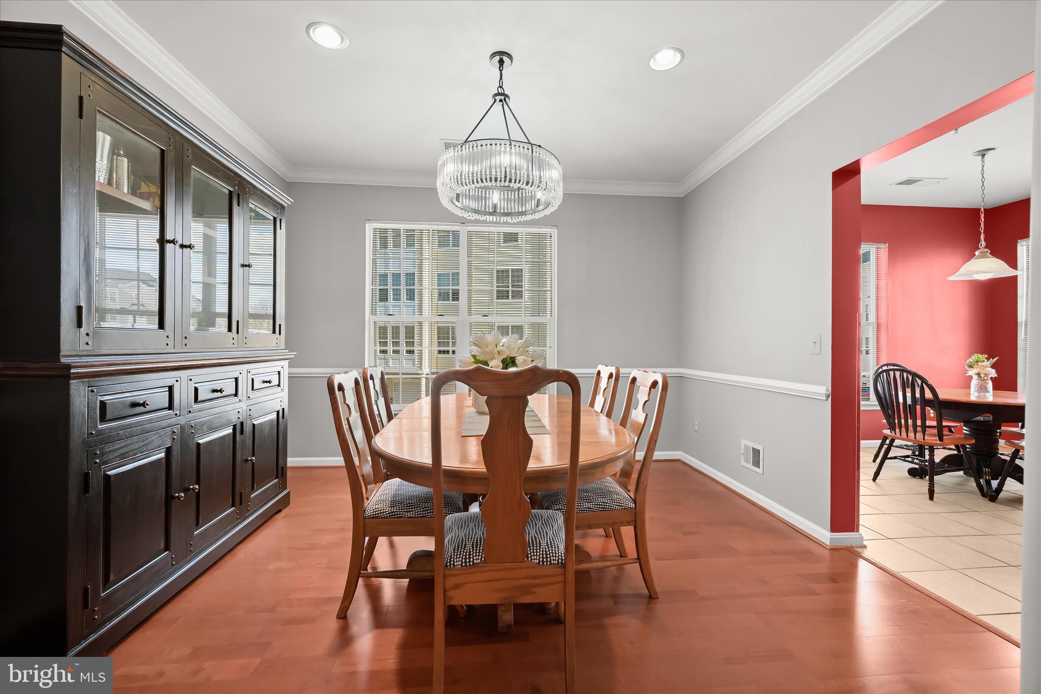 7305 Maplecrest Road, Unit 207 Elkridge, MD 21075 - Photo 10 of 50 a view of a dining room with furniture window and wooden floor