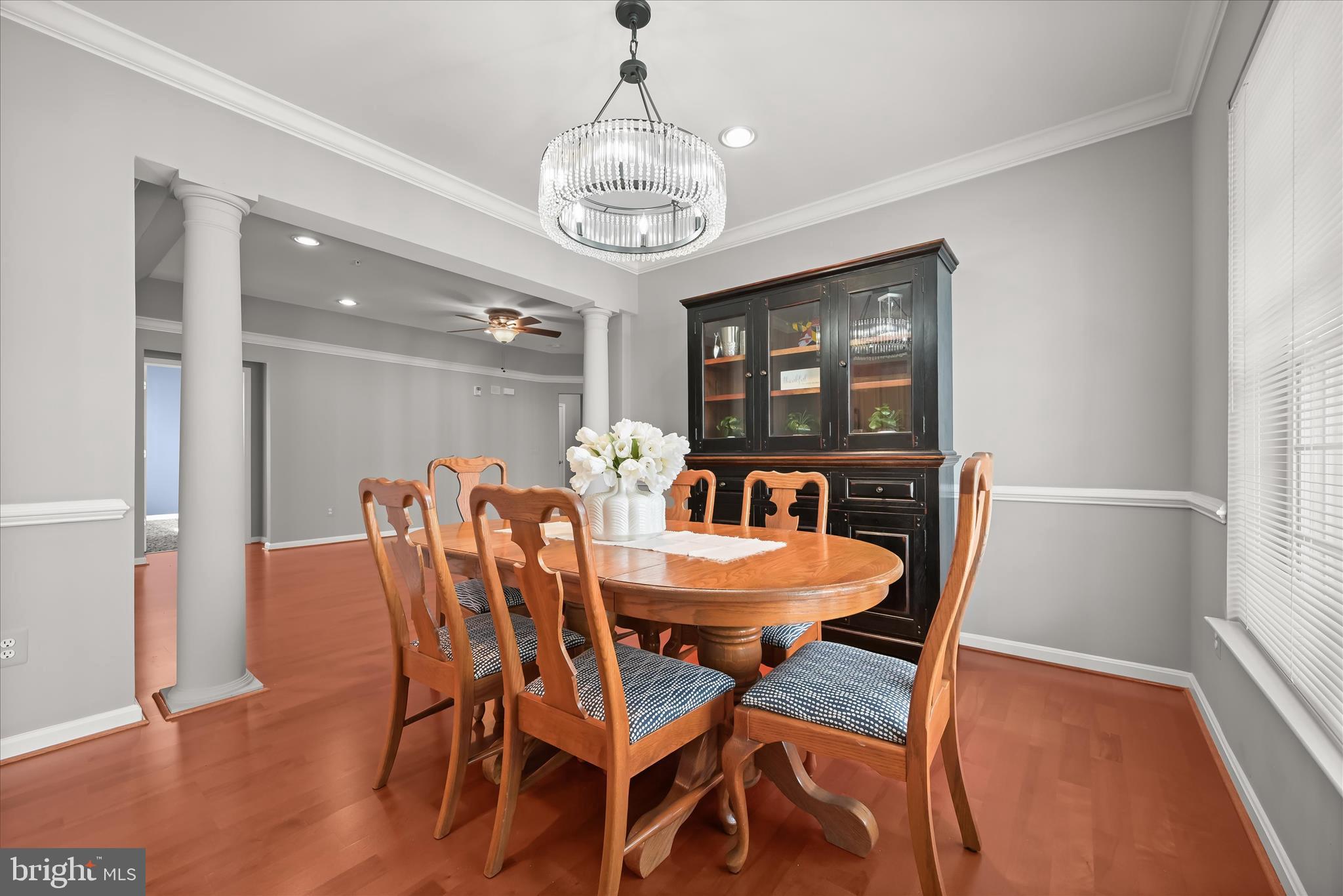 7305 Maplecrest Road, Unit 207 Elkridge, MD 21075 - Photo 11 of 50 a view of a dining room with furniture window and wooden floor