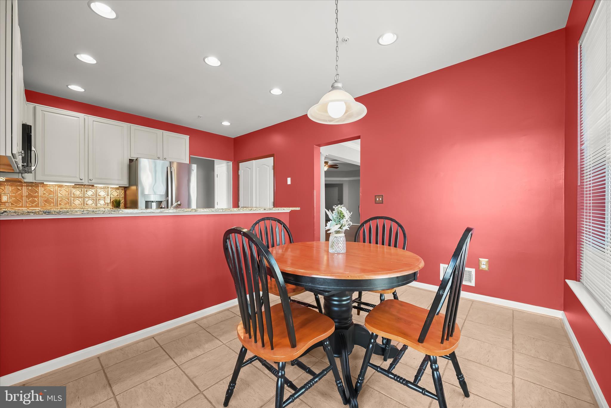 7305 Maplecrest Road, Unit 207 Elkridge, MD 21075 - Photo 16 of 50 a dining room with furniture and window