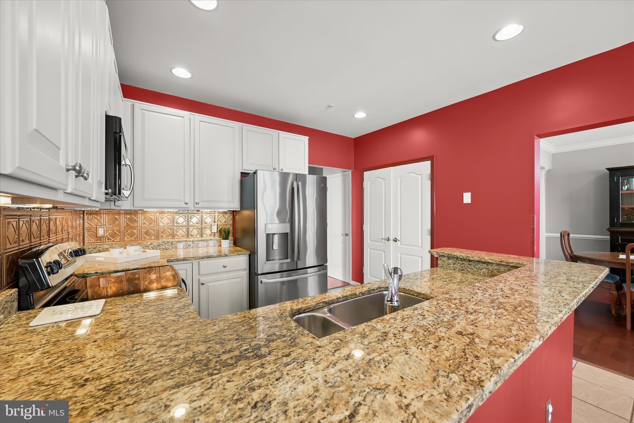 7305 Maplecrest Road, Unit 207 Elkridge, MD 21075 - Photo 19 of 50 a kitchen with a refrigerator sink and stove