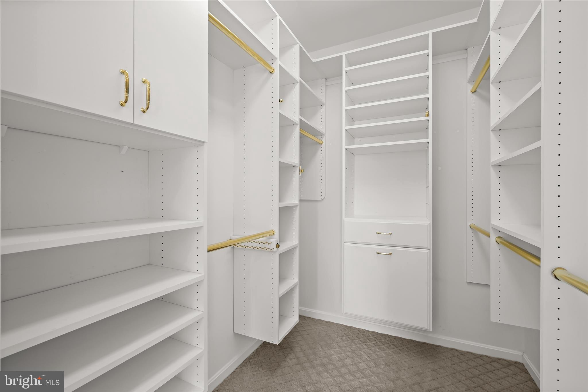 7305 Maplecrest Road, Unit 207 Elkridge, MD 21075 - Photo 25 of 50 a view of walk in closet with empty racks