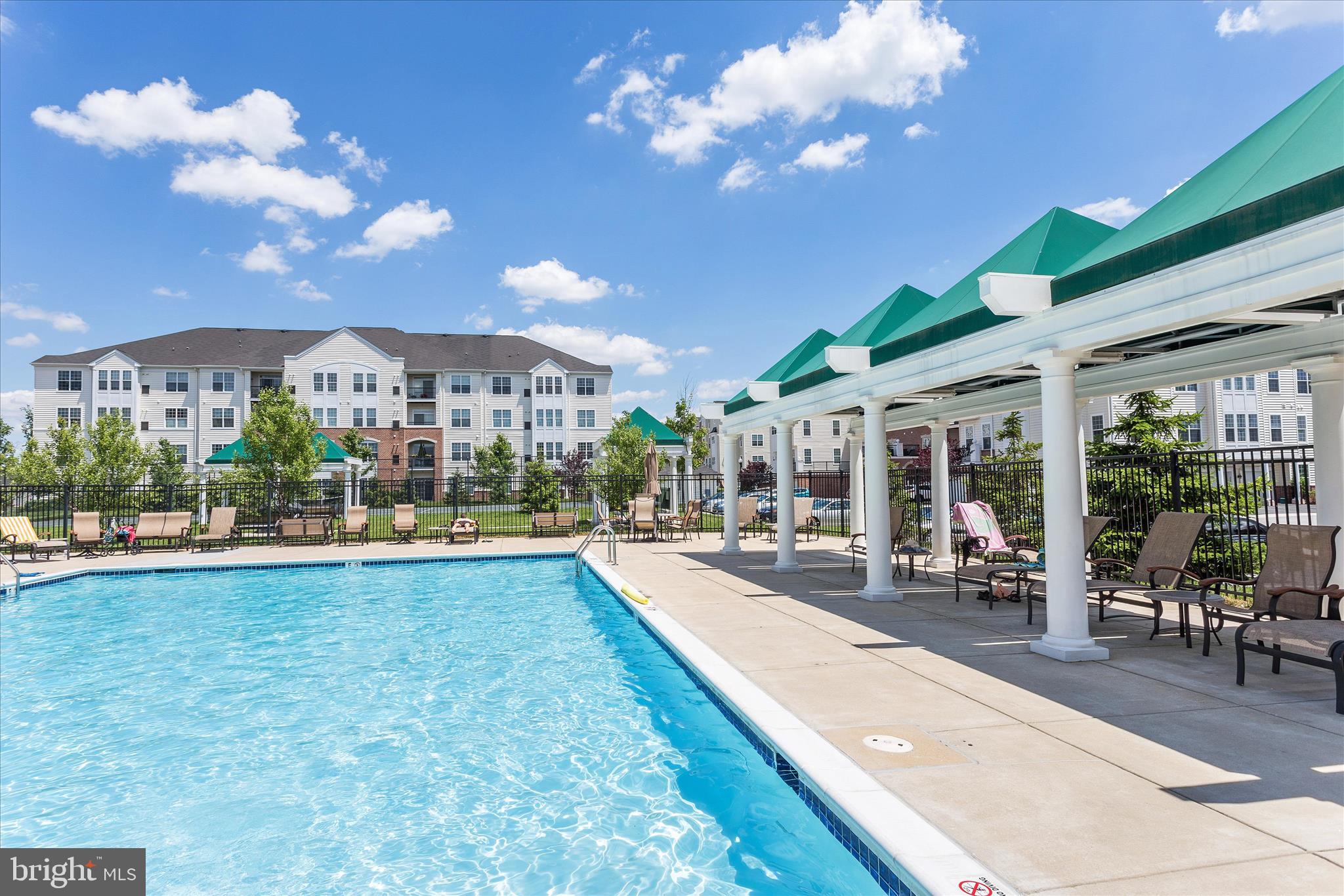 7305 Maplecrest Road, Unit 207 Elkridge, MD 21075 - Photo 46 of 50 a view of a swimming pool with outdoor seating