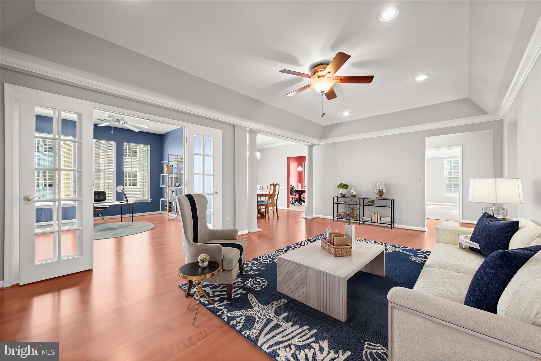 7305 Maplecrest Road, Unit 207 Elkridge, MD 21075 - Photo 5 of 50 a living room with furniture a ceiling fan and a rug