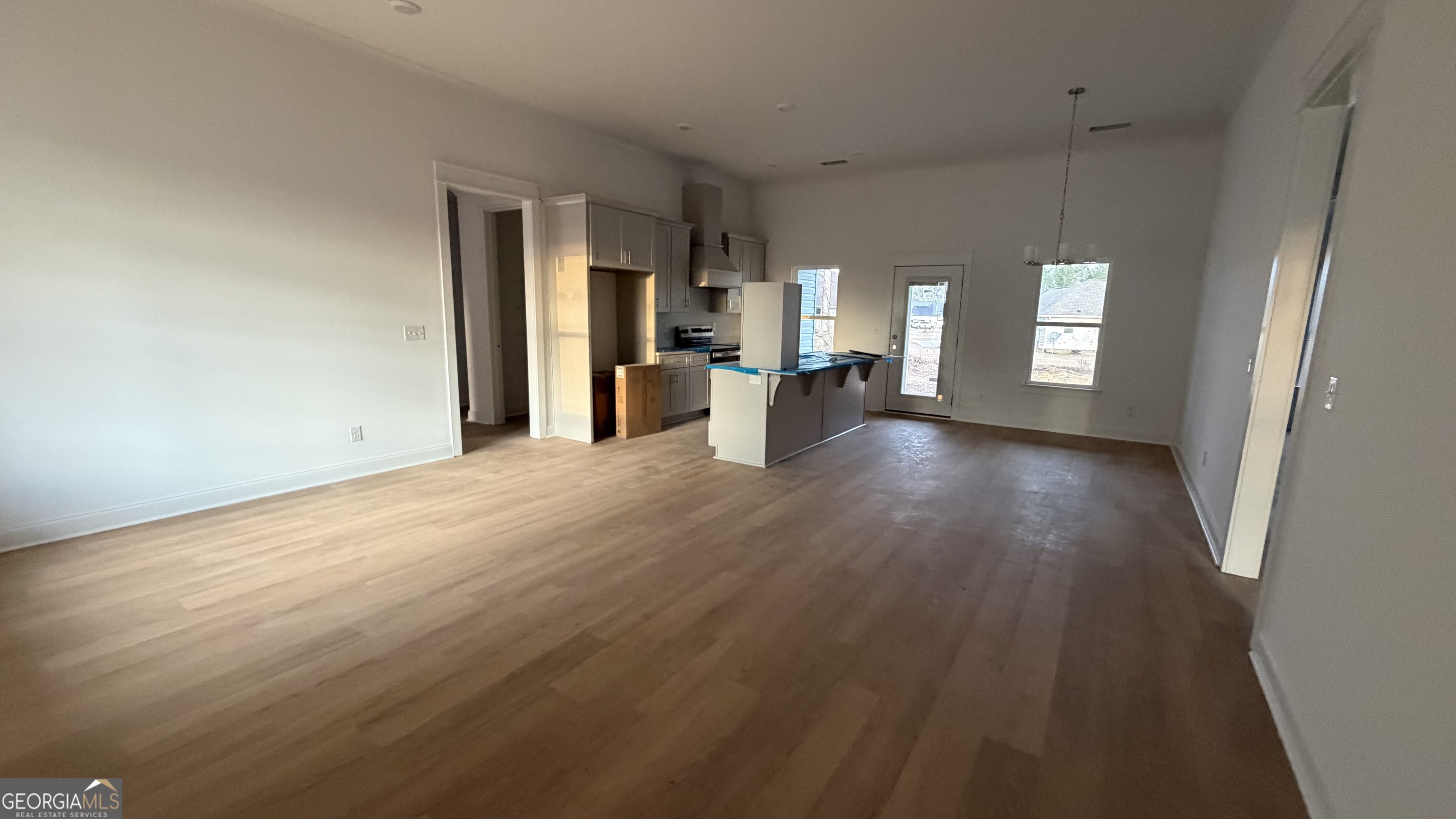 336 Mace Cannon Road Dublin, GA 31021 - Photo 2 of 18 wooden floor in an empty room with a window