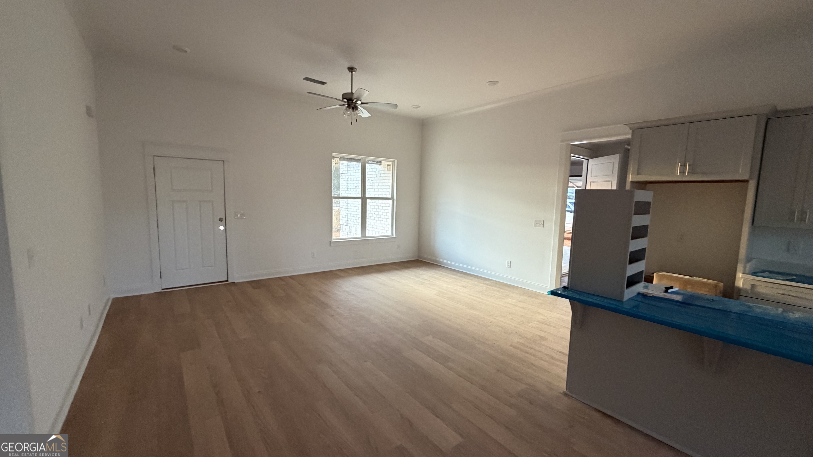 336 Mace Cannon Road Dublin, GA 31021 - Photo 3 of 18 a view of empty room with wooden floor and window
