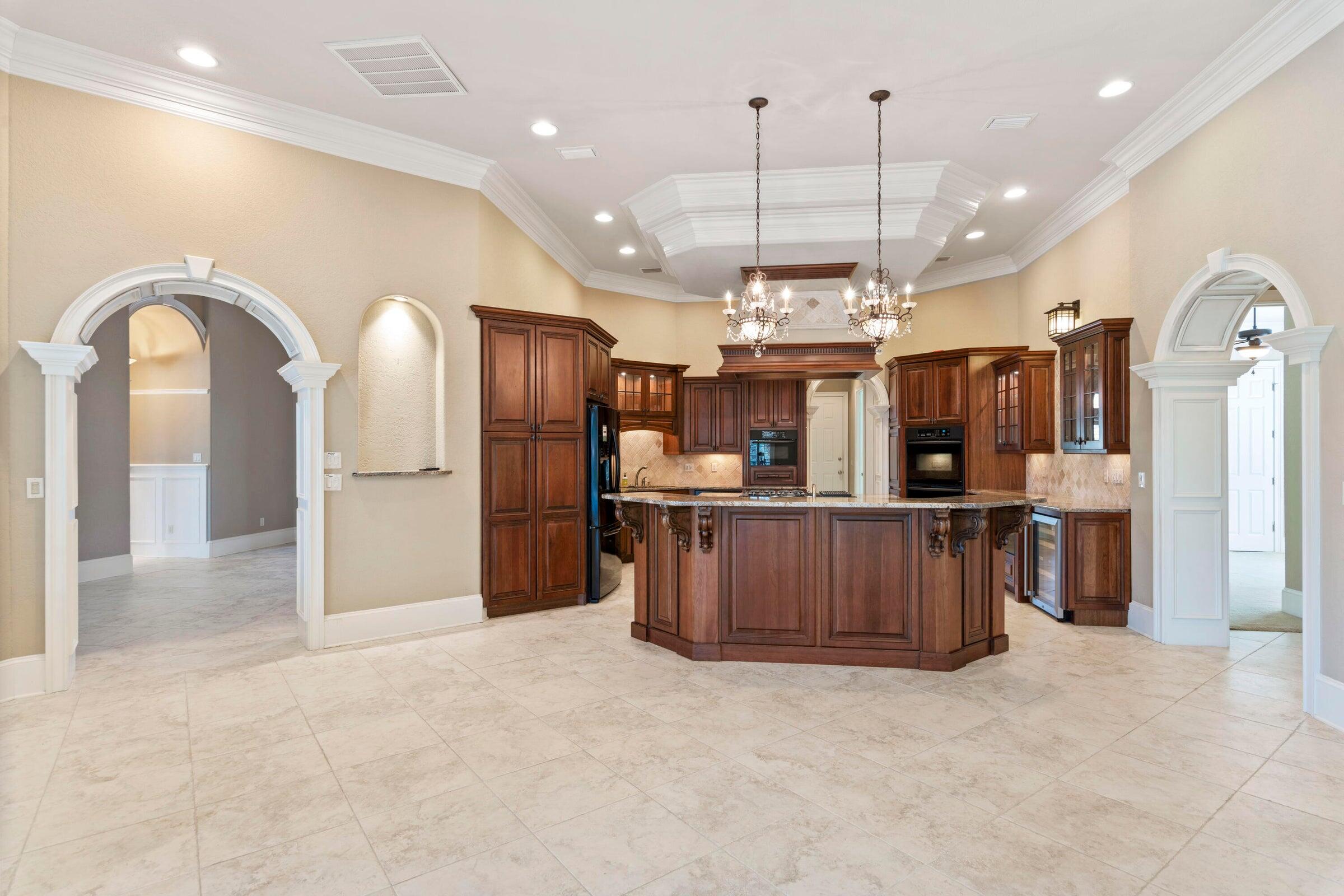 322 Emerald Ridge Santa Rosa Beach, FL 32459 - Photo 12 of 43 a view of kitchen with cabinets and refrigerator