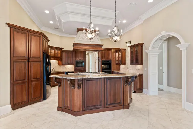 a kitchen with a table and chairs in it