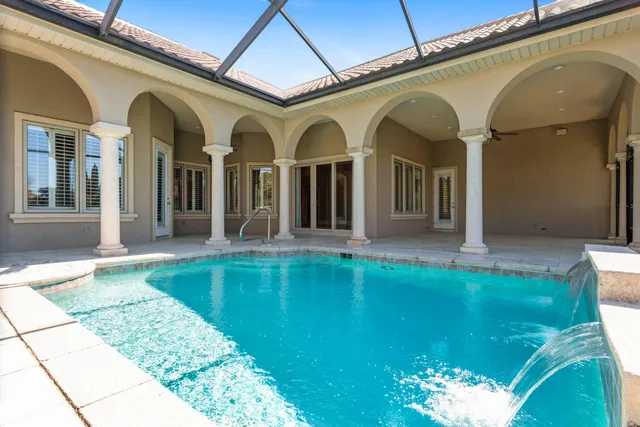 a view of an entryway with a floor to ceiling window and an outdoor view
