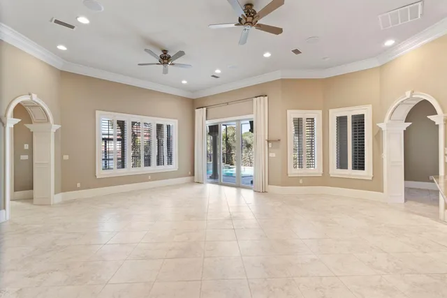 a view of a kitchen with a sink and a refrigerator