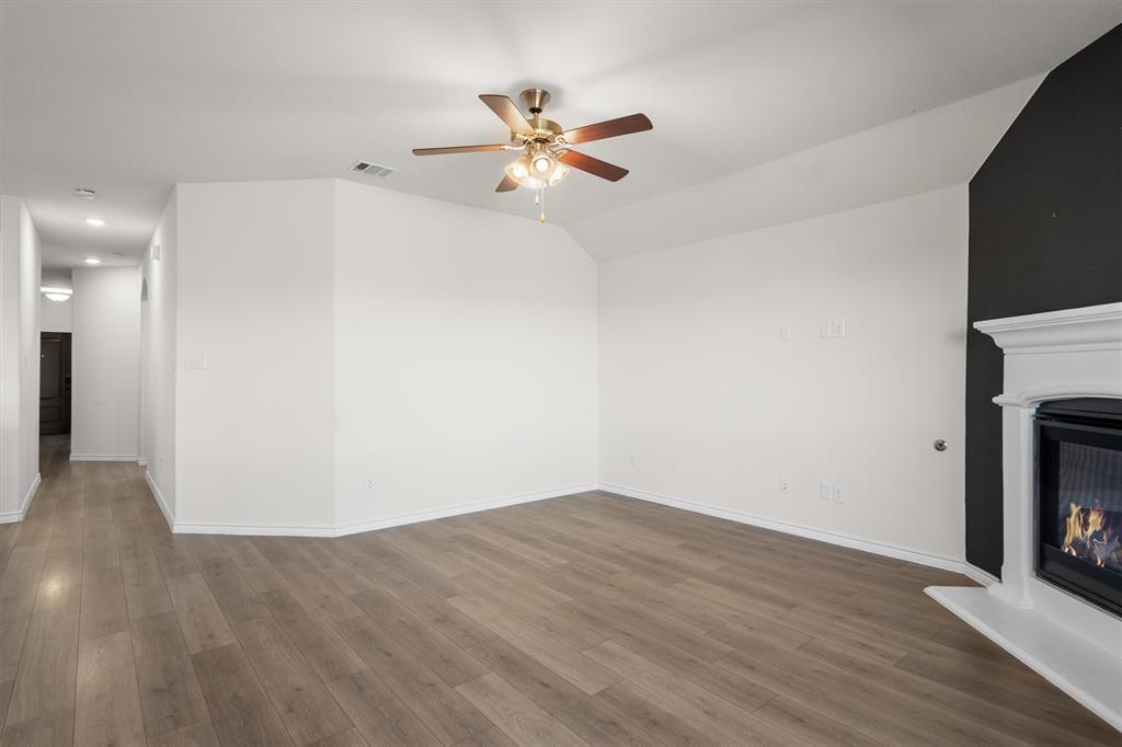 505 Maverick Street Anna, TX 75409 - Photo 14 of 39 a view of empty room with wooden floor and fan