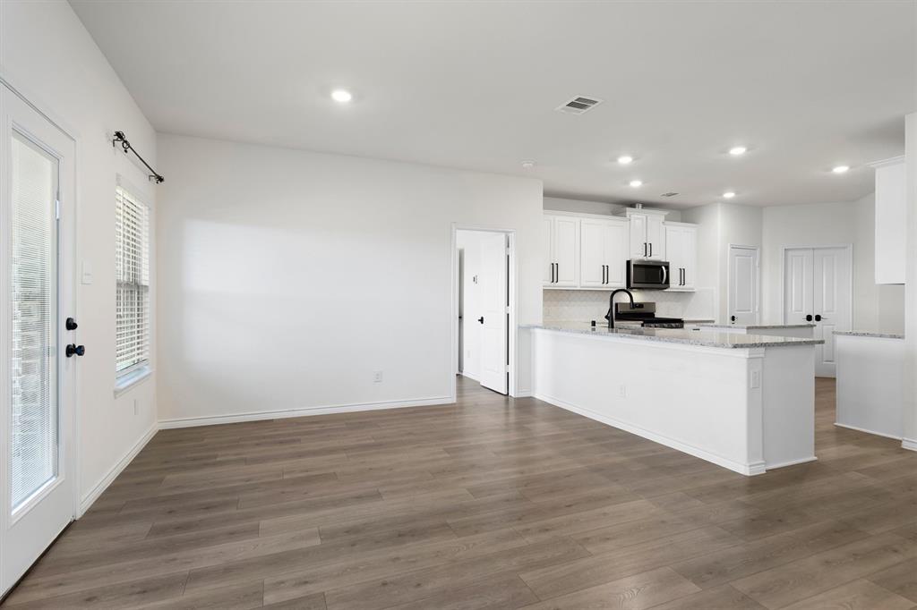505 Maverick Street Anna, TX 75409 - Photo 16 of 39 a view of kitchen with wooden floor