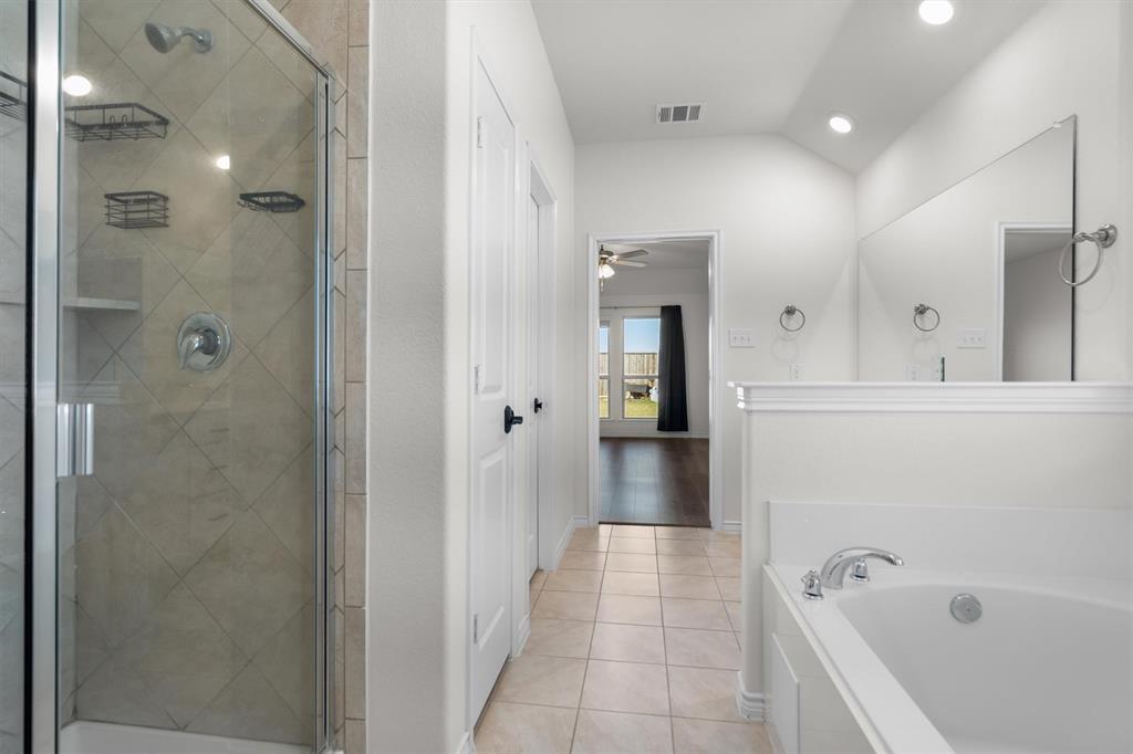 505 Maverick Street Anna, TX 75409 - Photo 31 of 39 a bathroom with a bathtub and a shower