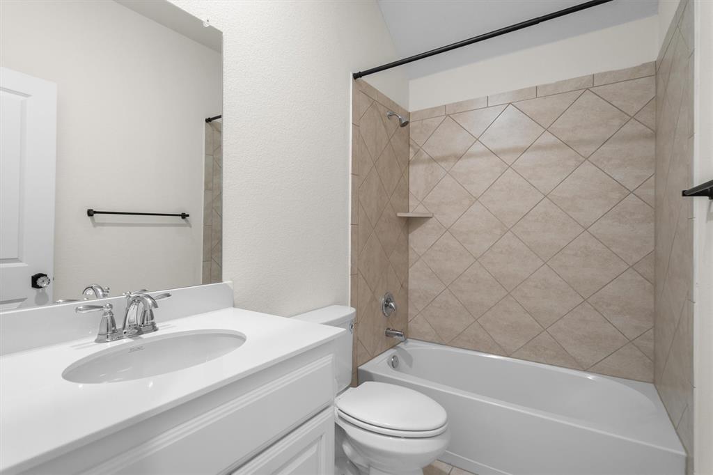 505 Maverick Street Anna, TX 75409 - Photo 34 of 39 a bathroom with a sink toilet and shower