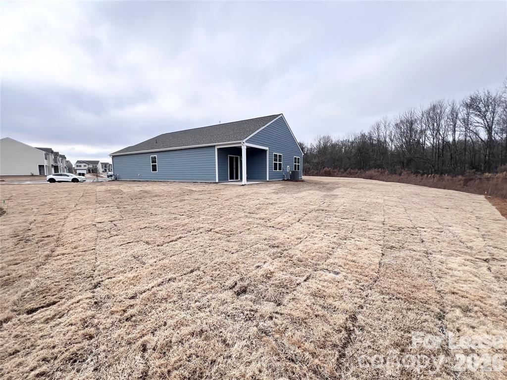 1700 Vanderlyn Street Monroe, NC 28112 - Photo 19 of 19 a view of a house with a yard