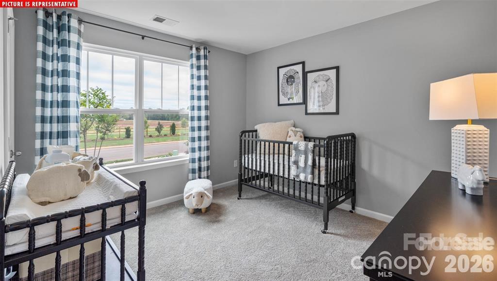 1700 Vanderlyn Street Monroe, NC 28112 - Photo 9 of 19 a bedroom with a bed and a window