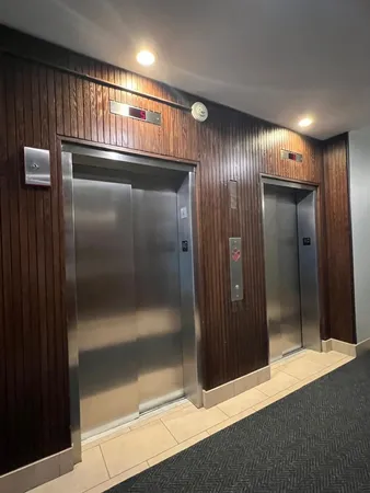 a view of elevator with wooden door