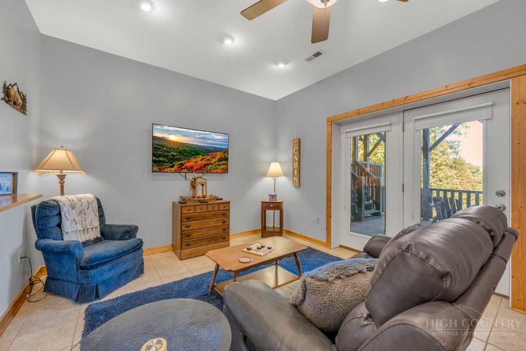 2229 Elk Ridge Road Ferguson, NC 28624 - Photo 34 of 42 a living room with furniture and a window