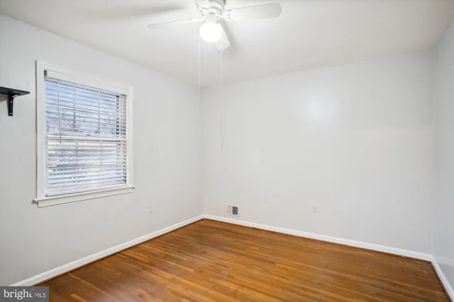 a room with stairs and wooden floor
