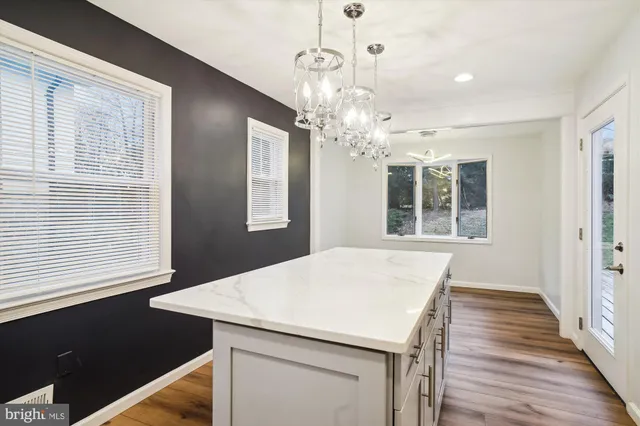 a view of a kitchen from the hallway