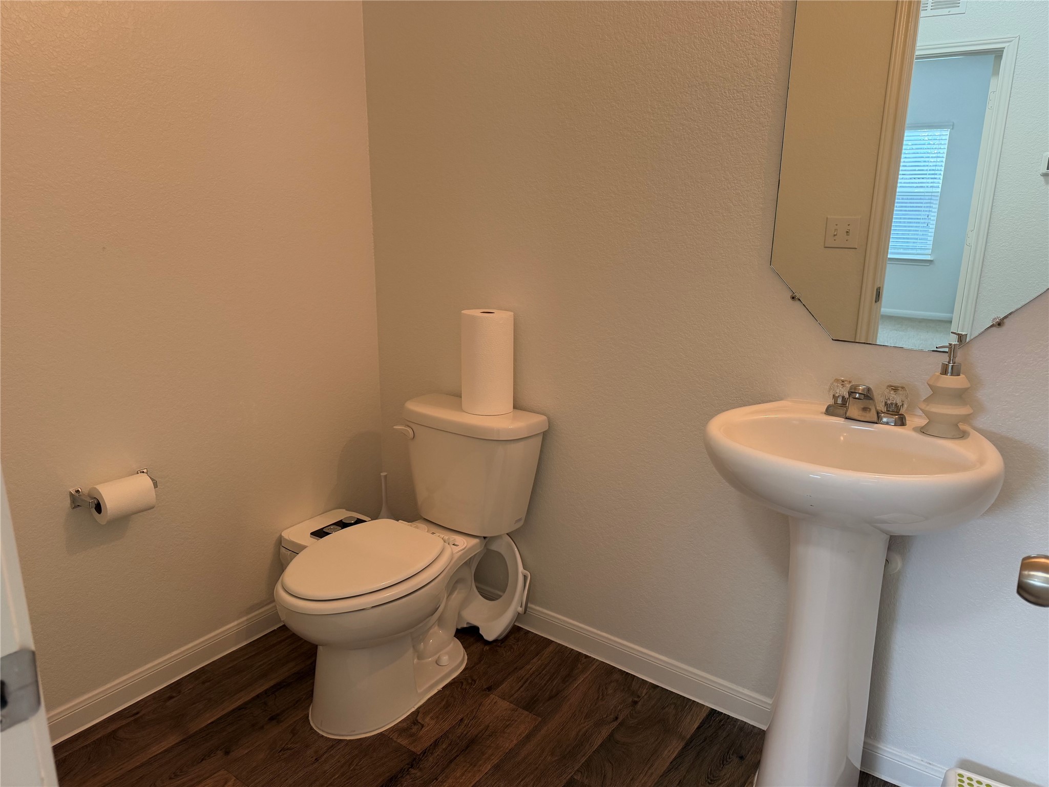 12111 Riprap Drive Manor, TX 78653 - Photo 4 of 14 a bathroom with a sink toilet and a mirror