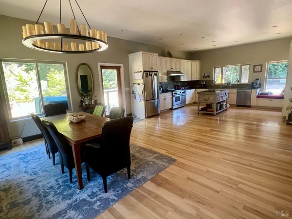 a view of a dining room with furniture window and wooden floor