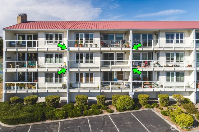 an aerial view of a house with a lake view