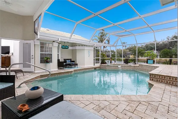 a view of a swimming pool with a patio