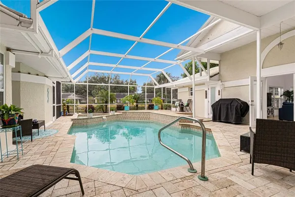 an aerial view of a house with swimming pool