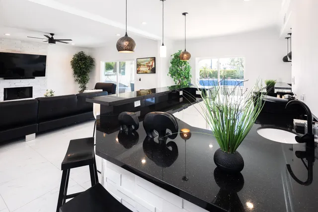 a kitchen with a refrigerator a sink and a stove