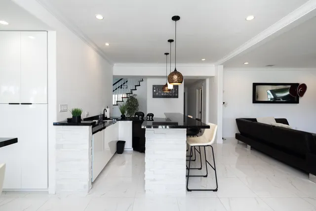 a view of a hallway view with wooden floor and staircase