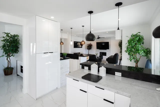 a living room with wooden floor and furniture