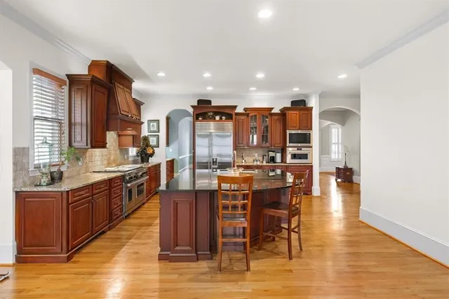 a dining room with furniture a rug and a window
