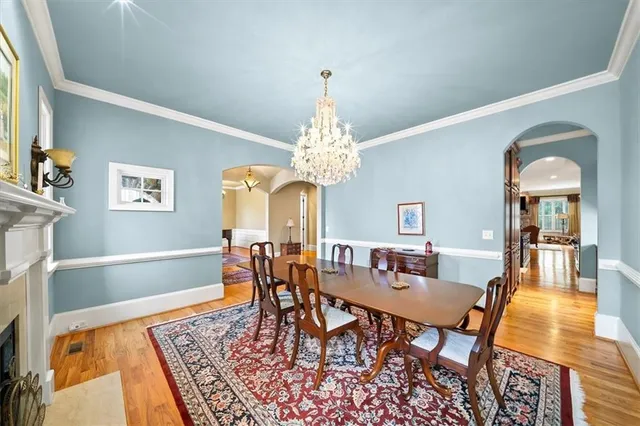 a bathroom with a granite countertop tub sink and mirror
