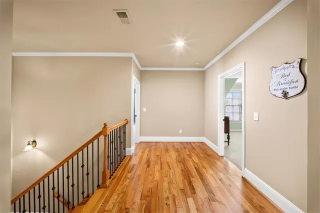 a large living room with furniture a flat screen tv and a large window