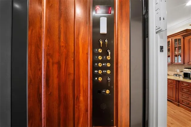 a kitchen with stainless steel appliances granite countertop a sink stove and microwave