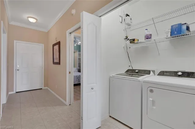 a view of storage and utility room with washer and dryer
